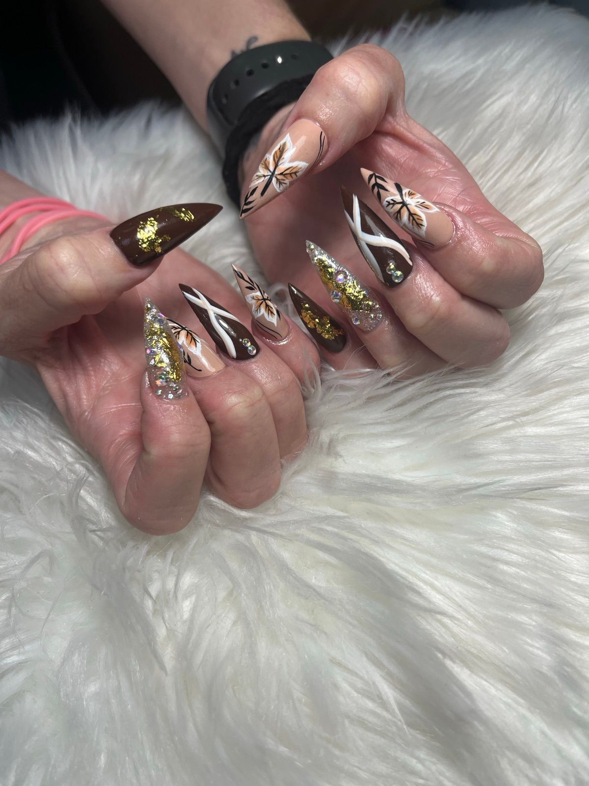 Brown, nude and gold foil stiletto nails with white line art