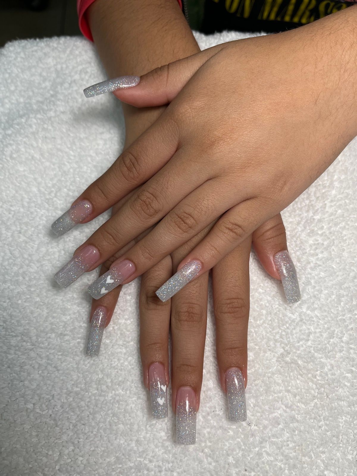 Long clear to silver glitter ombre square nails with heart accents