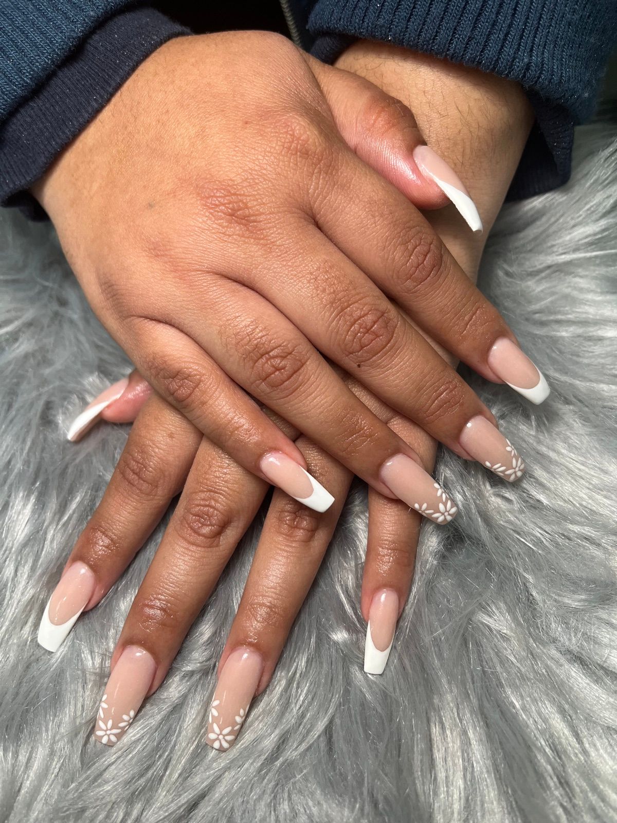 Long coffin nails with white French tips and white flower accents