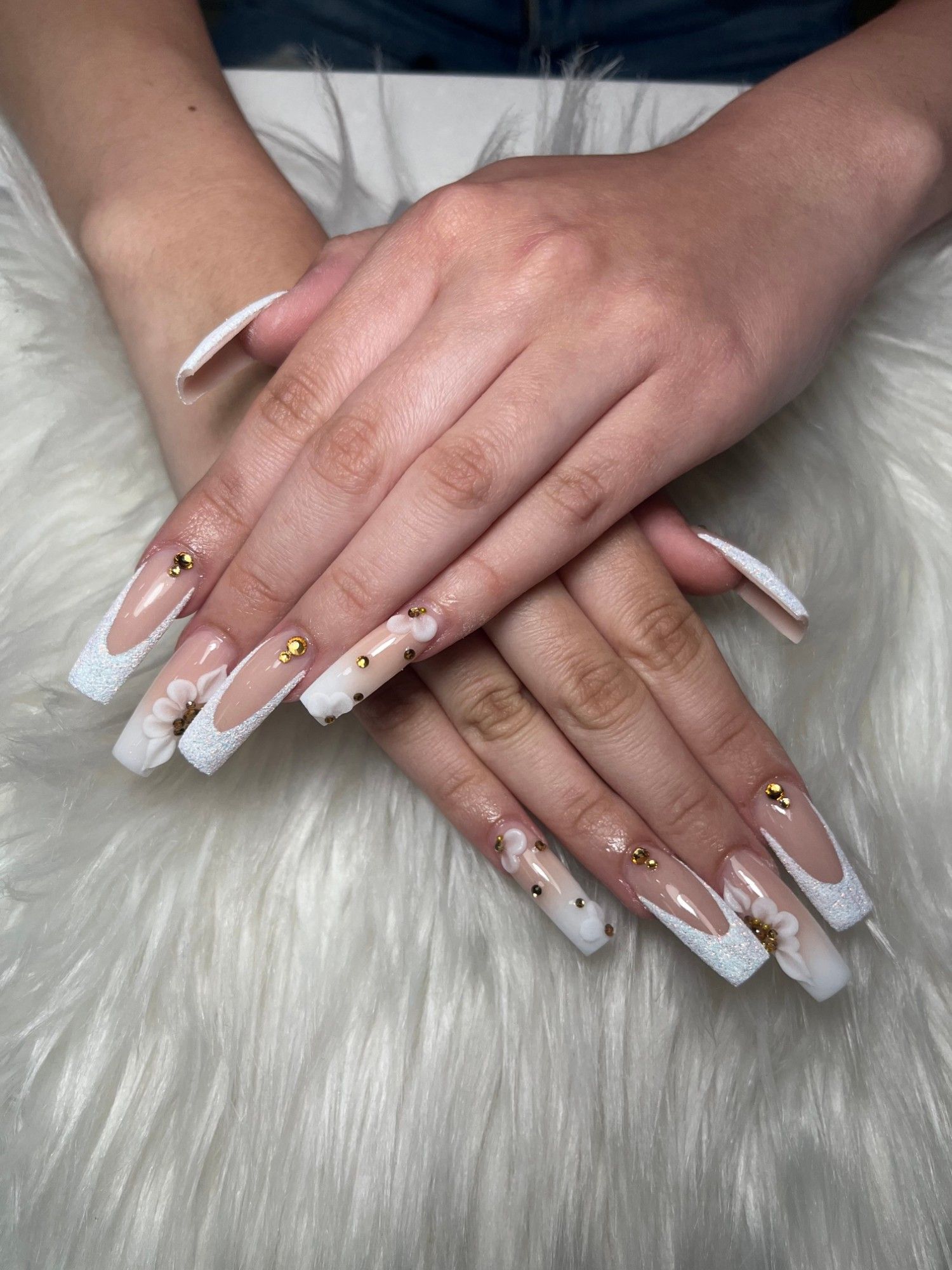 Long white French square nails with 3D flowers and gold studs