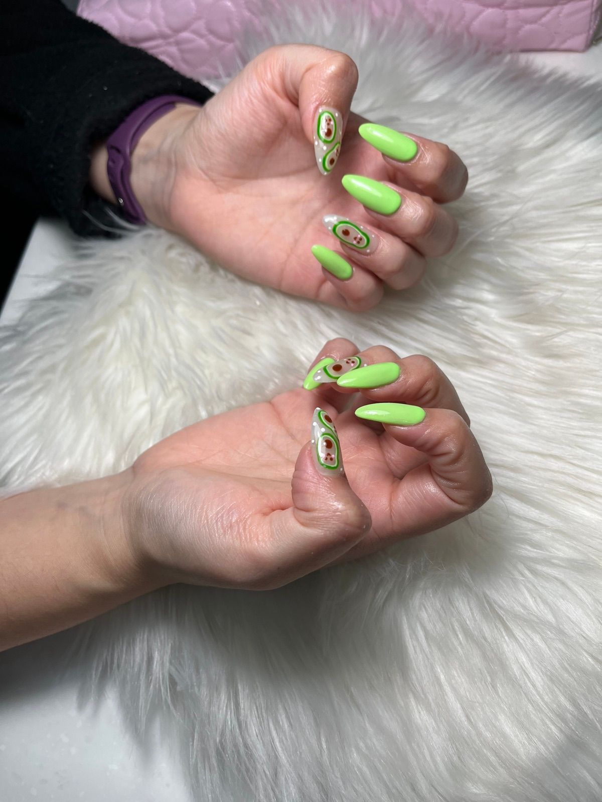 Long neon green almond nails with hand-painted avocados