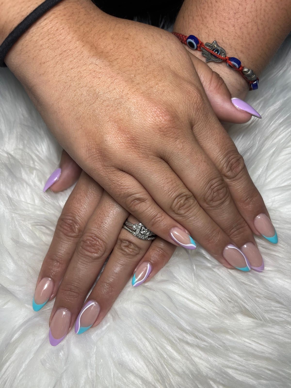 Almond nails with pastel lilac and blue swirl French tips