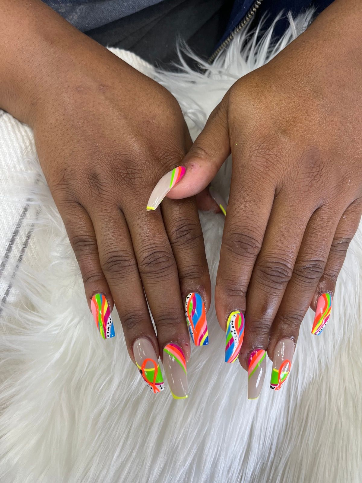 Long rainbow abstract swirl coffin nails on a nude base