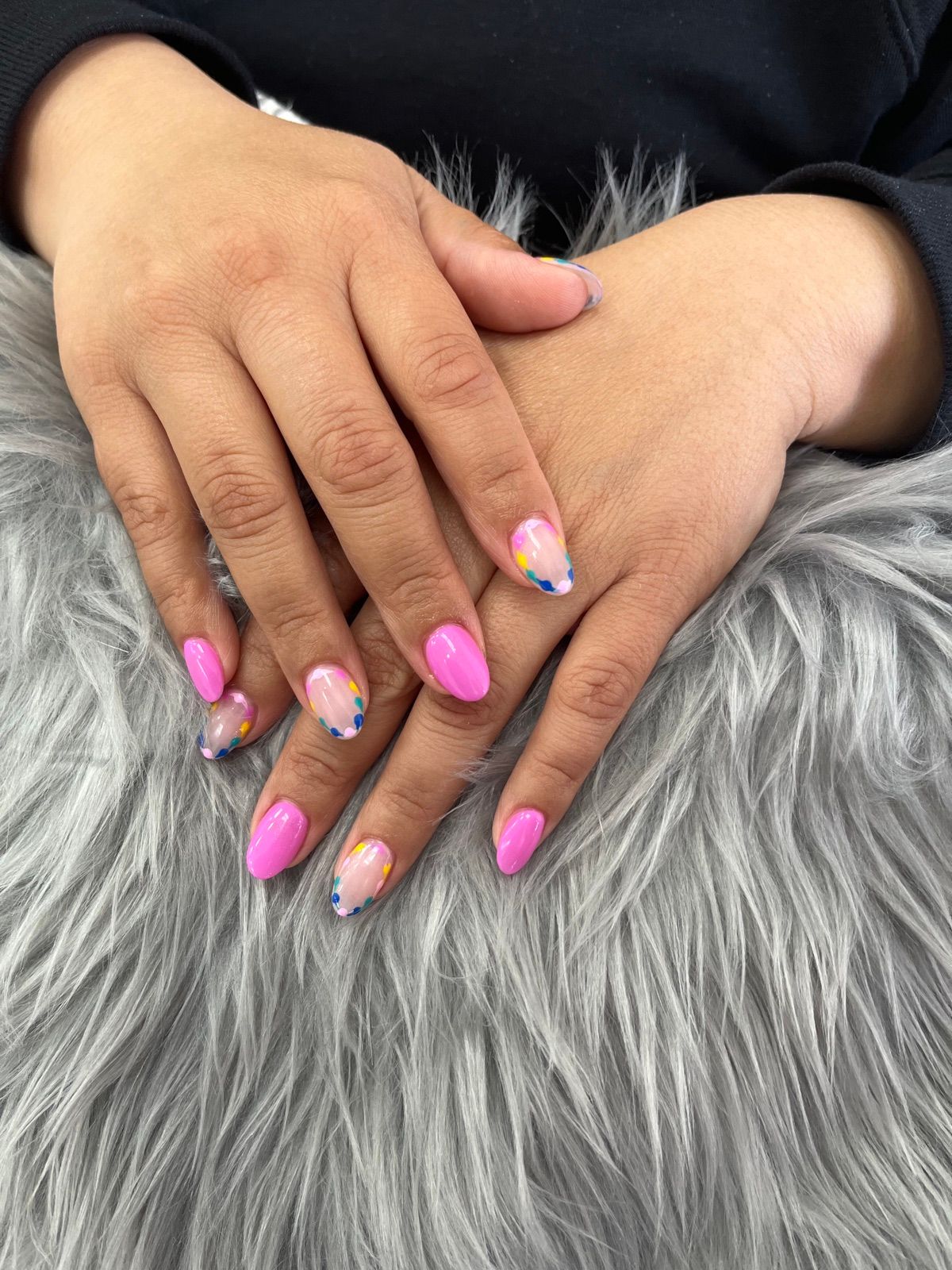 Short hot pink almond nails with pastel watercolor accents