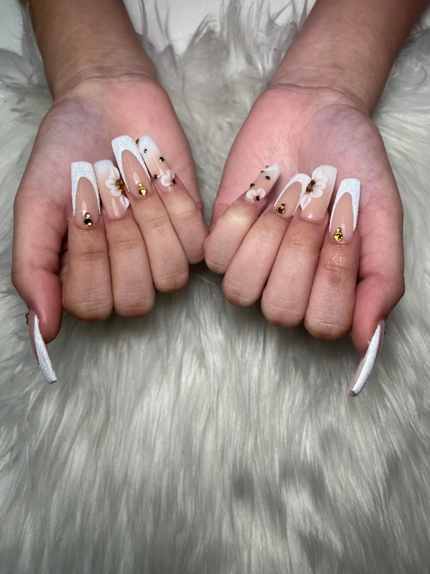 White V French tip nails with 3D flowers and gold studs